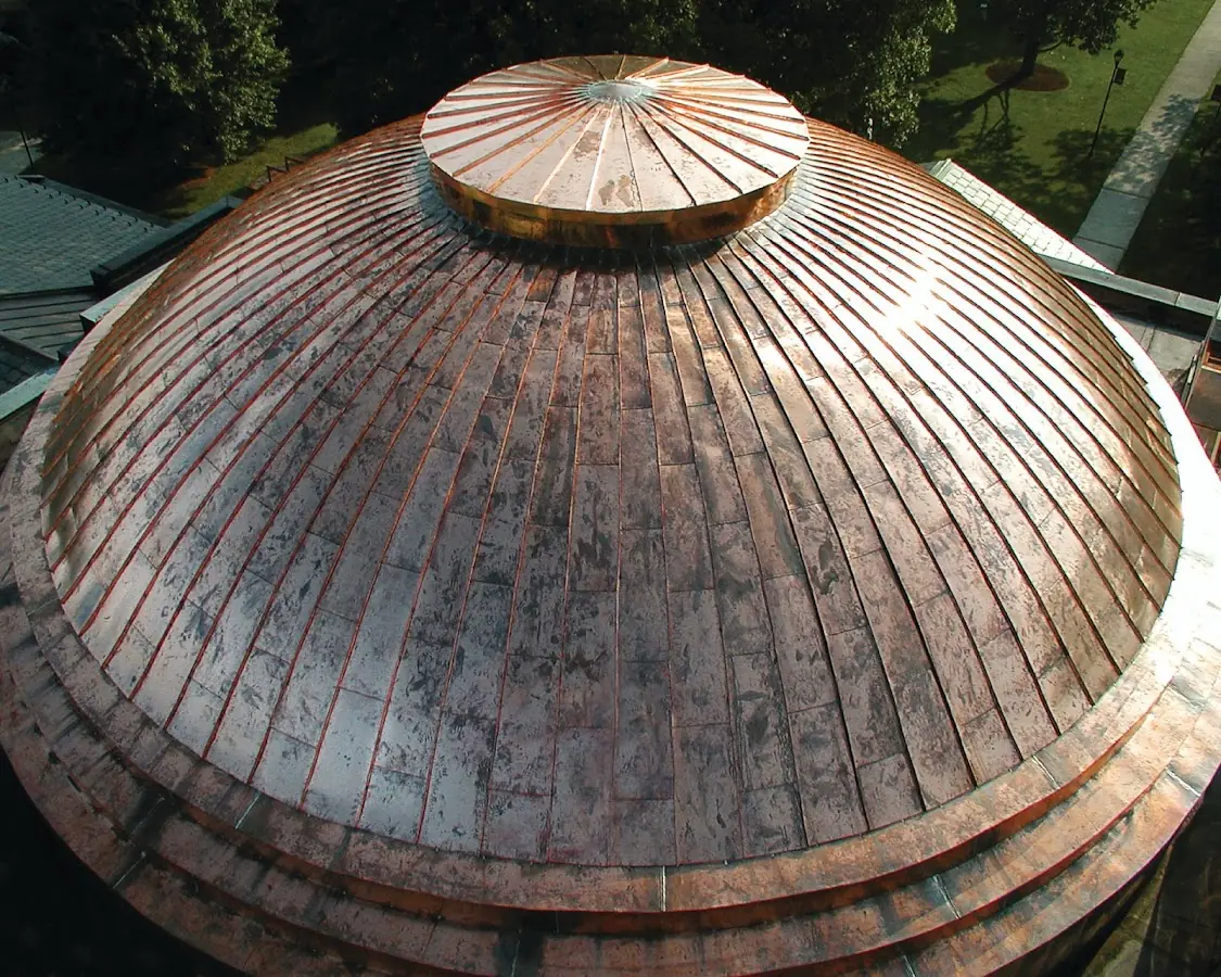 Craftsman Roofing crew installing a new roof in Williamsville